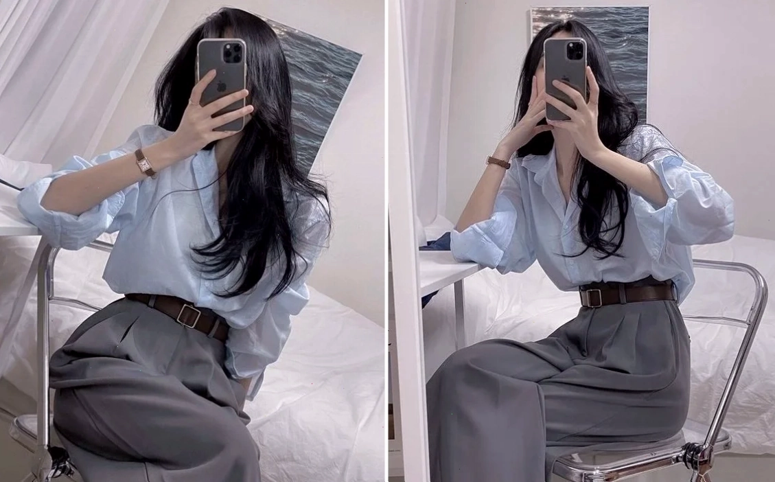 Cô gái tạo dáng ngồi trên ghế trước gương